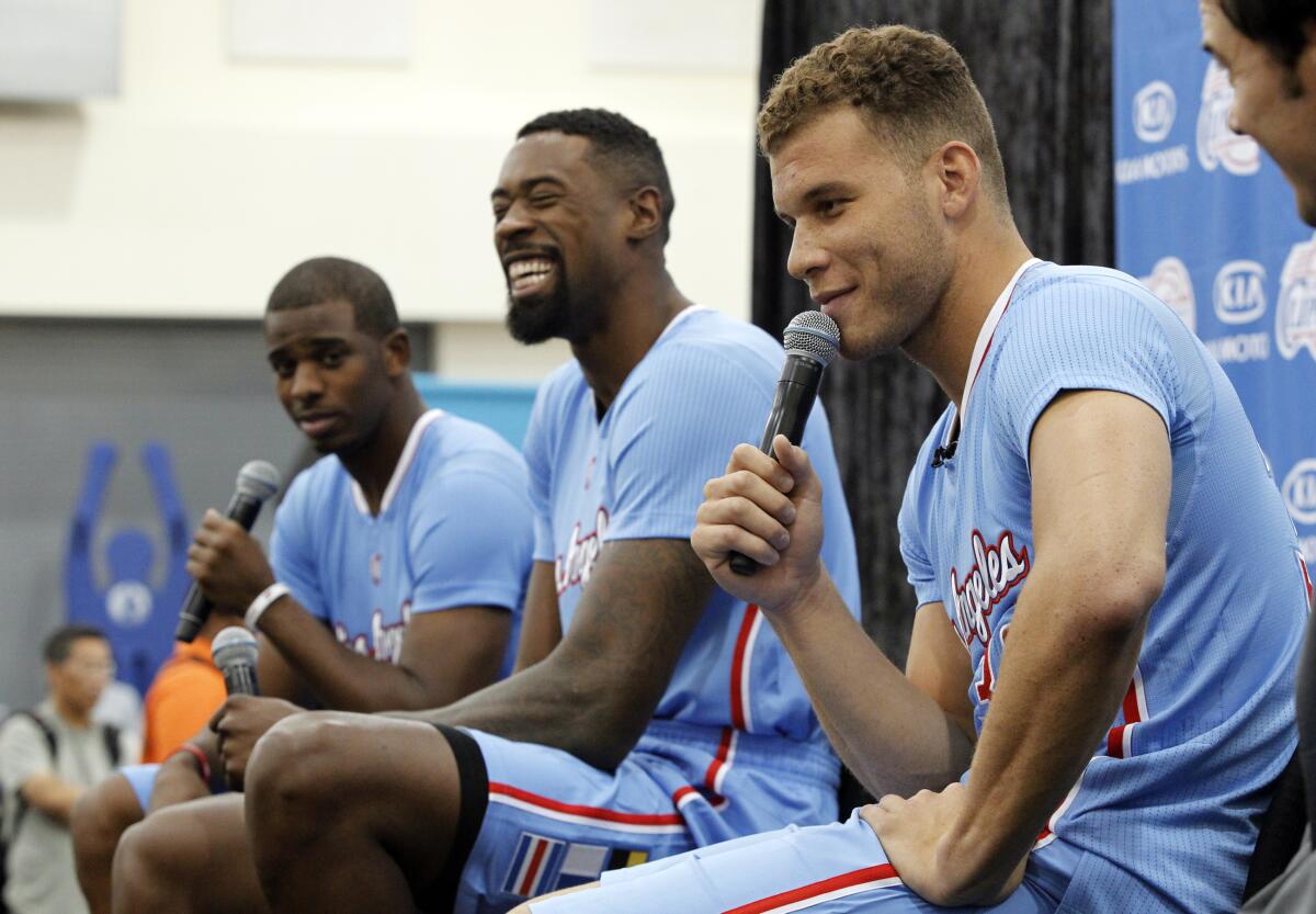 Clippers players (from left) Chris Paul, DeAndre Jordan and Blake Griffin speak during the team's media day in 2013.