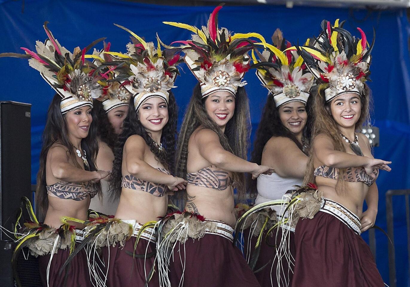 Members of the Hawaiian traditional dance group Aroha Tahi, perform and open the 2016 Asian Pacific Festival at the Dunes Resort on Saturday.