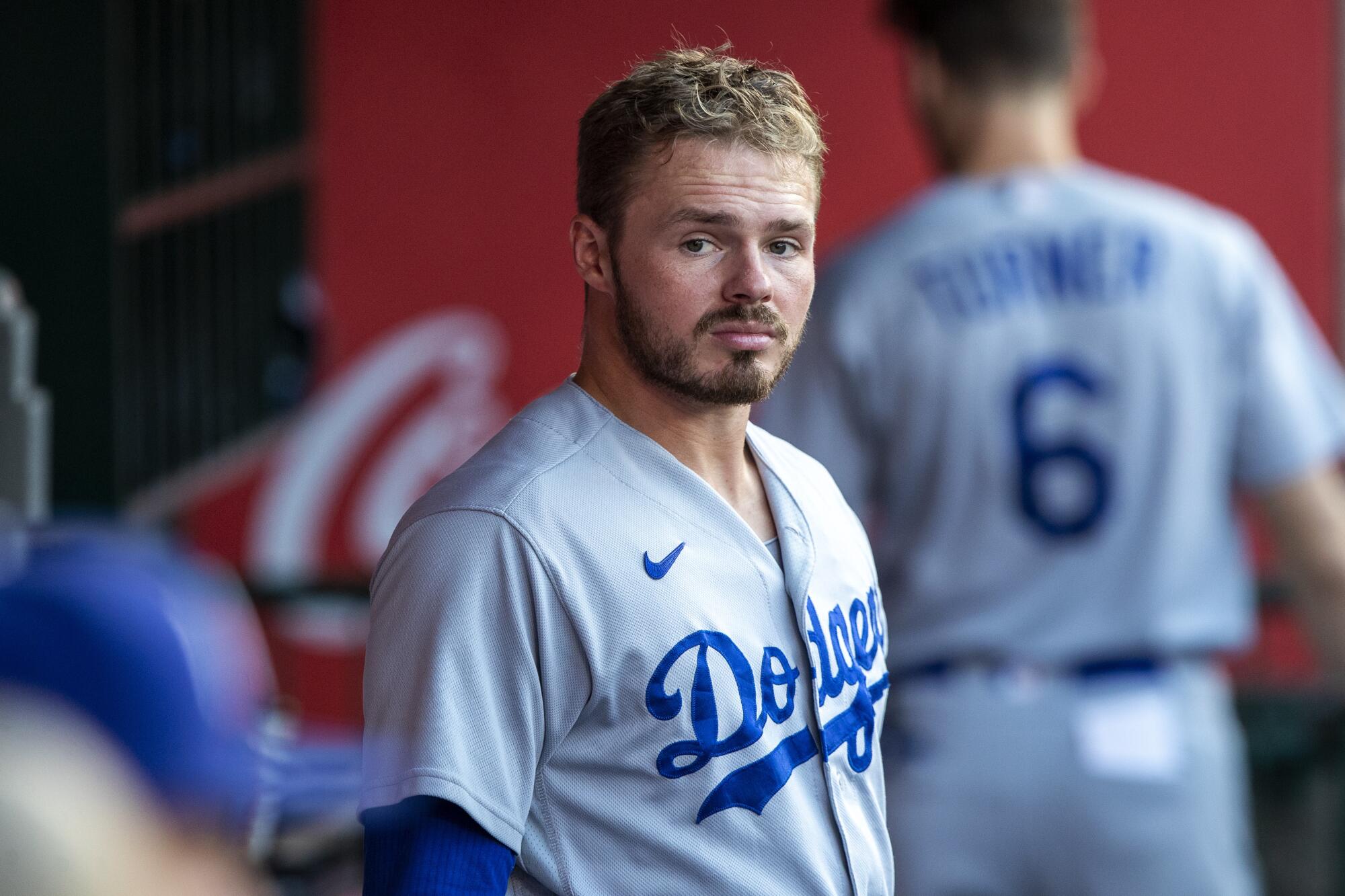 Los Angeles Dodgers' Gavin Lux looks over in the dugout before a baseball game.