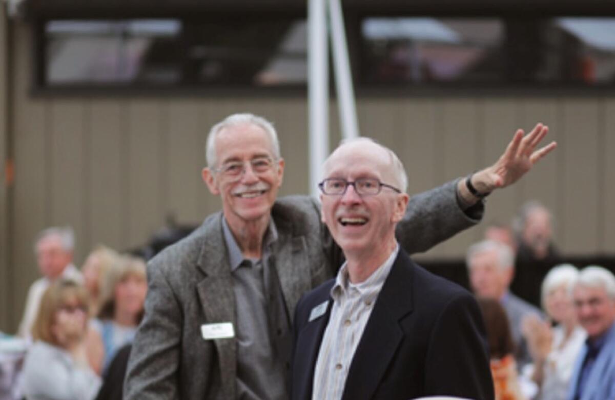 Wayne Peterson, left, and Terry Smith are honored at a Laguna College of Art and Design event. 