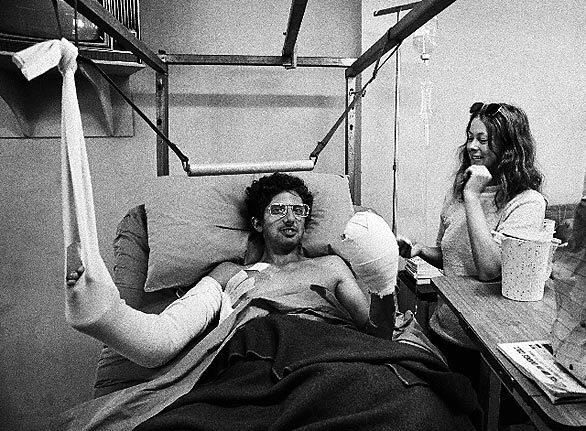 Roxanna Brown, right, in May 1972, visiting Time Magazine correspondent David DeVoss after he was injured in a mortar attack. Seeing that DeVoss was immobilized, Brown teasingly lifted his bed clothes to peek at his naked body. It was one of those funny wartime situations, DeVoss recalled. Lets laugh and have a good time cause tomorrow we may die.