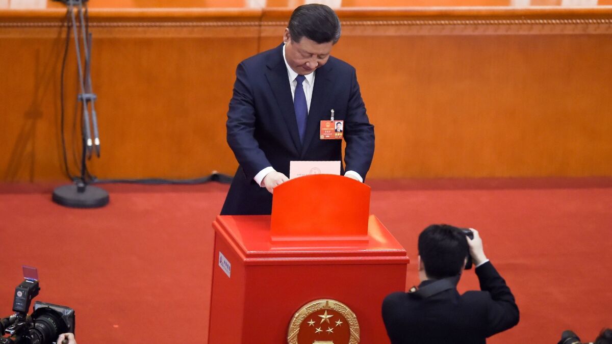 Chinese President Xi Jinping votes at the Great Hall of the People in Beijing.