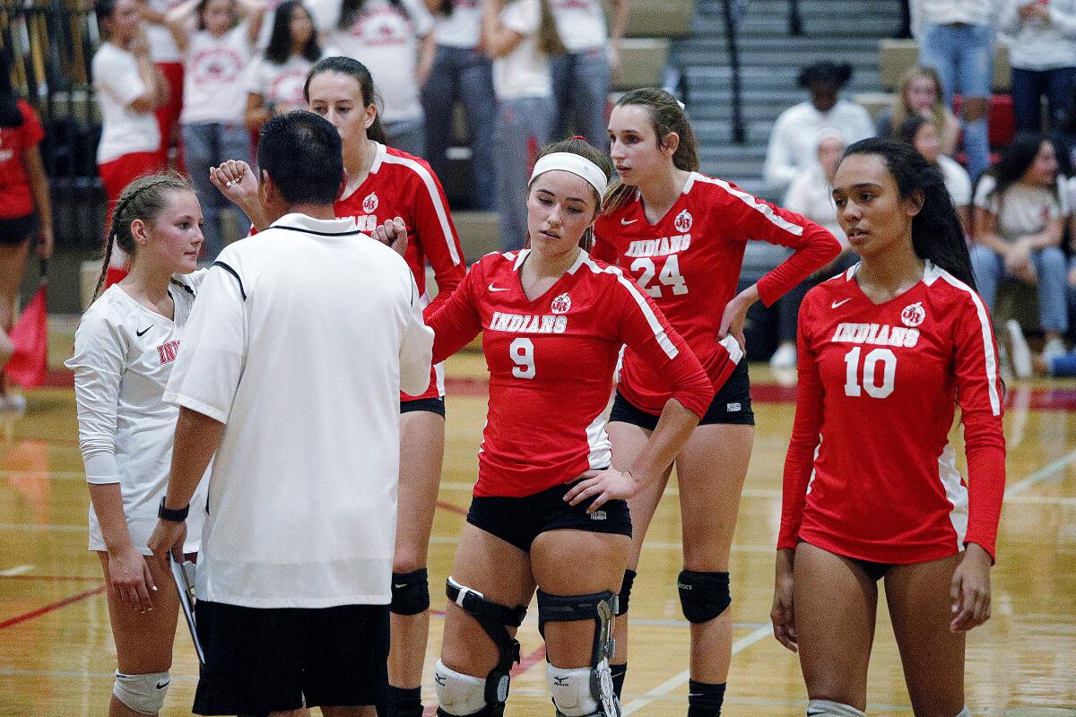 The dejected faces of the Burroughs High girls' volleyball team after the final point in a playoff loss Thursday evening to Murrieta Valley.