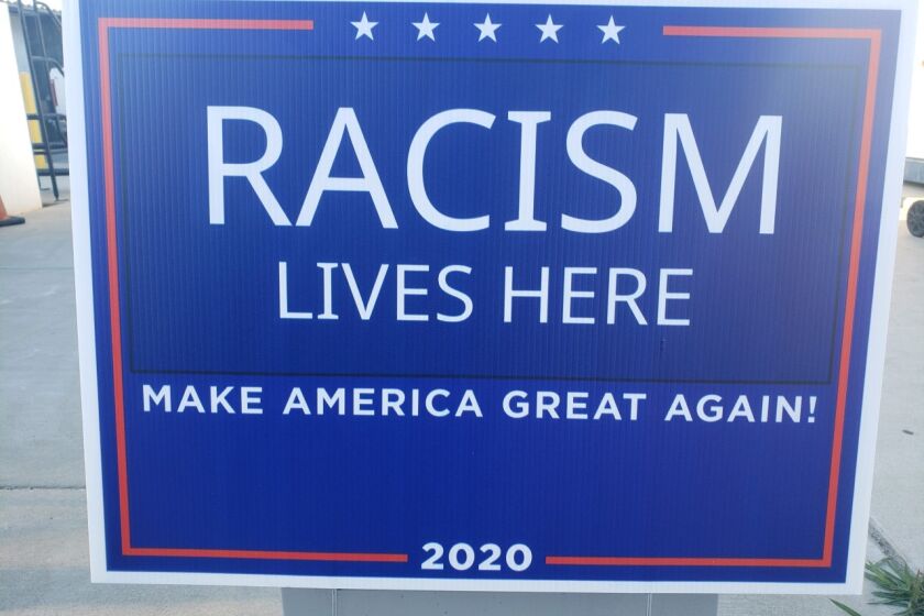 Some Trump supporters in Coronado woke up to find these signs on their lawn. The signs read, "Racism Lives Here Make America Great Again"