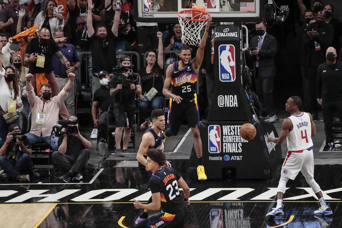 Suns forward Mikal Bridges celebrates after dunking against the Clippers in Game 1.