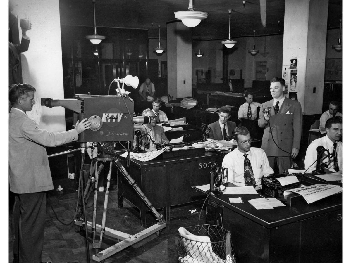 Reporter Bob Hartmann comments on election results to KTTV camera in 1950