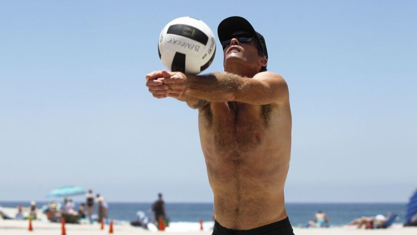 Matt Olson plays beach volleyball at the Moonlight Beach volleyball courts in Encinitas.