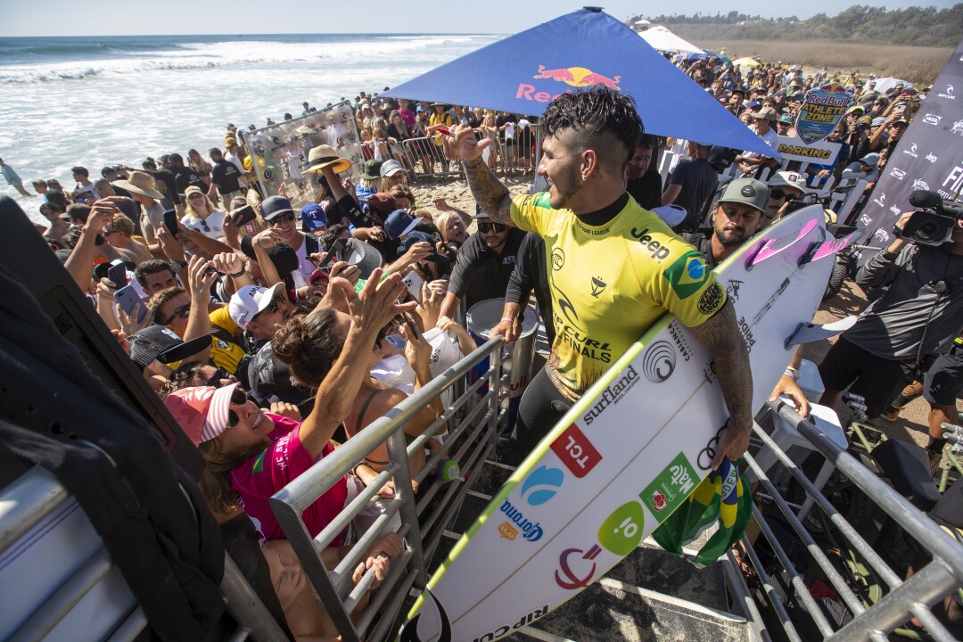 Gabriel Medina celebrates beating fellow countryman Filipe Toledo to win his third World Surf League Championship Title