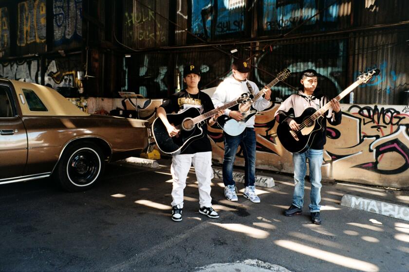 LOS ANGELES, CA - APRIL, 18, 2022: Yahritza, Mando and Jairo Martinez hanging out at SoHo Warehouse in Downtown, Los Angeles on April 18th, 2022. The trio, led by Yahritza, age 15, have a band called Yahritza Y Su Esencia, whose song, Soy El Unico recently went viral, shooting them to the No. 1 Spot of the Hot Latin Songs Billboard Chart.