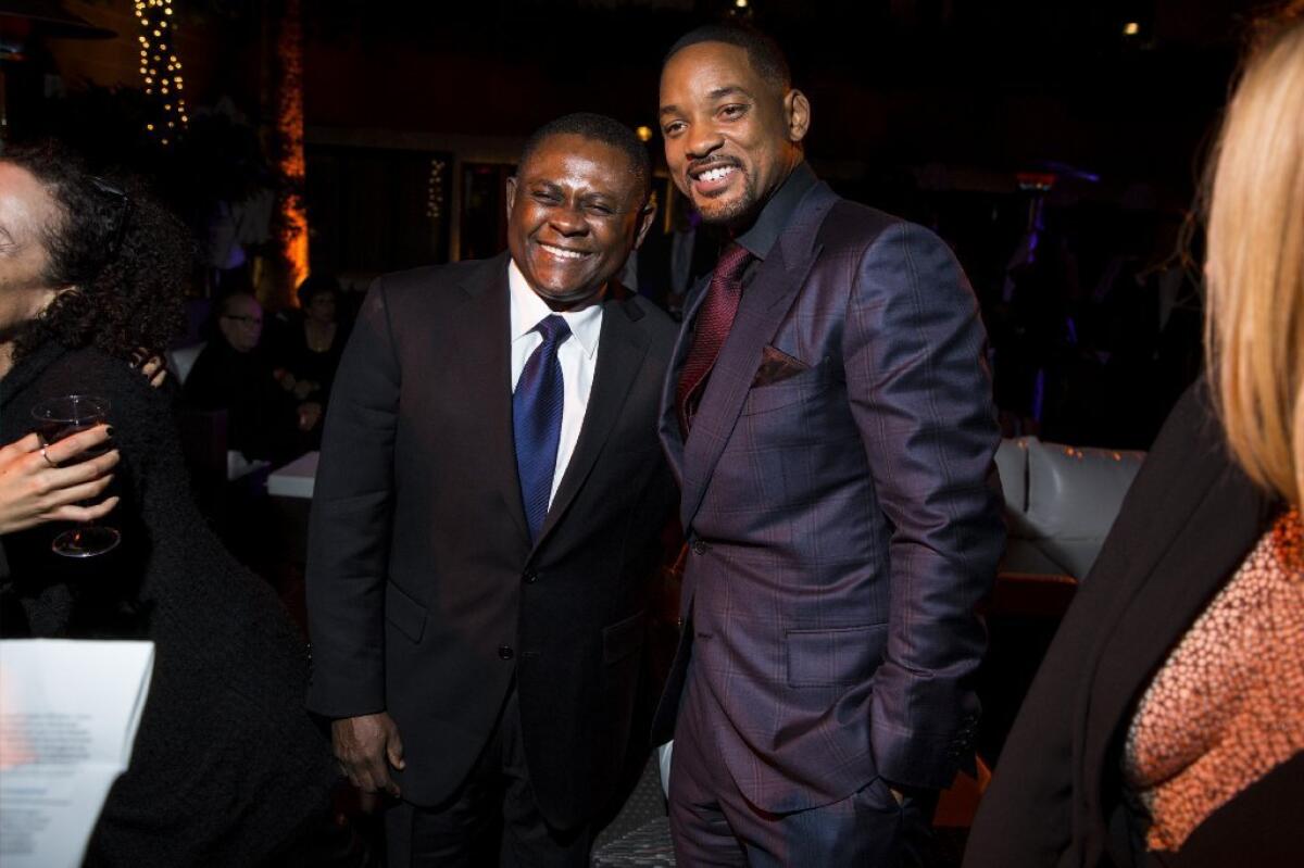 Actor Will Smith and Dr. Bennet Omalu, whom Smith portrays, attend the party following the AFI Fest premiere of "Concussion."