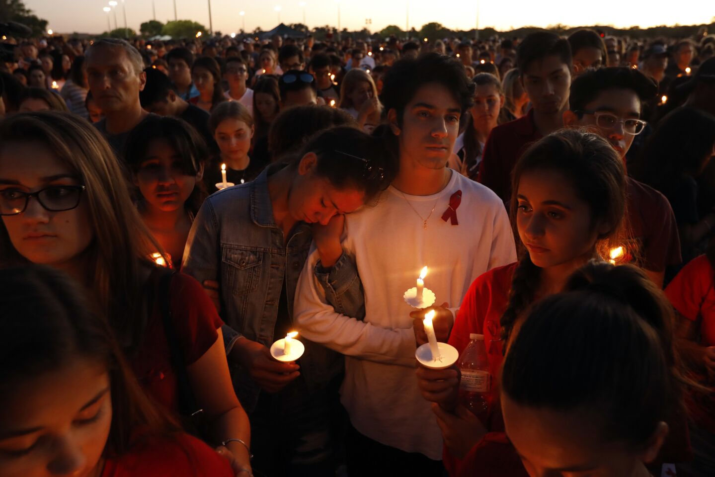 Thousands gather for an evening vigil at Pine Trails Park in Parkland, Fla. to remember those killed and injured in the shooting at Marjory Stoneman Douglas High School.