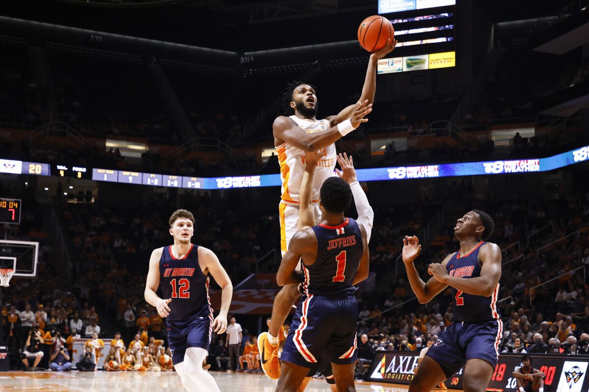 Tennessee guard Josiah-Jordan James (30) shoots over Tennessee-Martin guard Koby Jeffries (1) during an NCAA college basketball game Tuesday, Nov. 9, 2021, in Knoxville, Tenn. (AP Photo/Wade Payne)