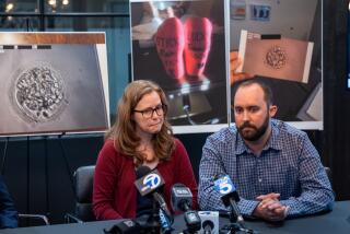 Santa Ana, CA - April 23: Brooke Berger speaks and Bennett Hardy listens during a press conference announcing a lawsuit against Newport Beach fertility clinic Ovation Fertility at Rob Marcereau law office in Santa Ana Tuesday, April 23, 2024. Brooke Berger and Bennett Hardy are one of nine couples that are suing Newport Beach fertility clinic Ovation Fertility alleging the clinic destroyed their embryos. (Allen J. Schaben / Los Angeles Times)