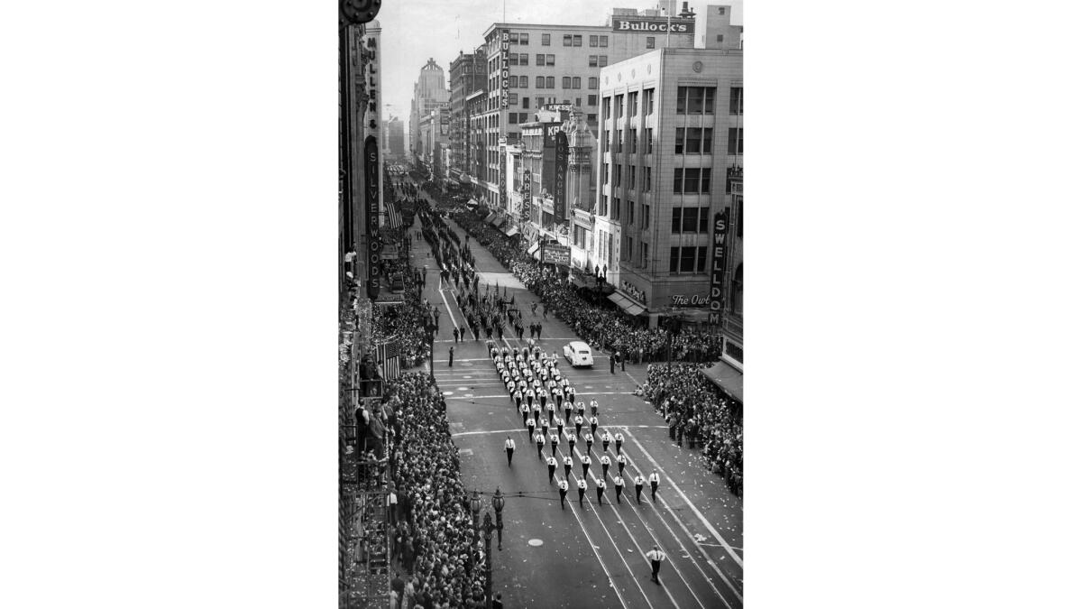 Nov. 11, 1941: New Army units, service organizations and State Guard units march down Broadway at 7th Street during annual Armistice Day parade one month before Pearl Harbor.