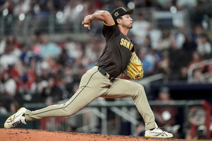 San Diego Padres pitcher Yu Darvish (11) works in the seventh inning of a baseball game against the Atlanta Braves, Sunday, May 19, 2024, in Atlanta. (AP Photo/Mike Stewart)