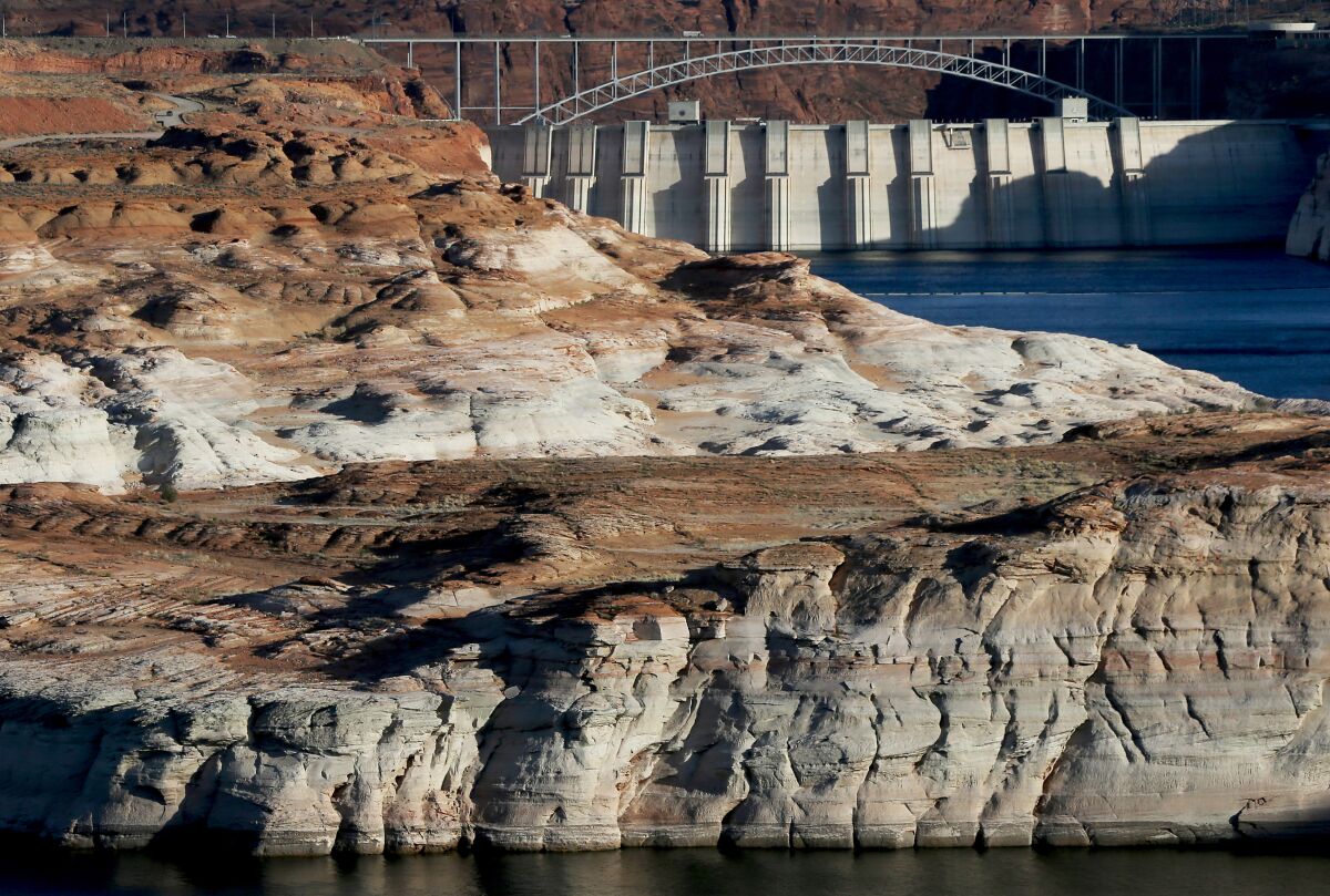 Water flows down the Colorado River at the Glen Canyon Dam. 