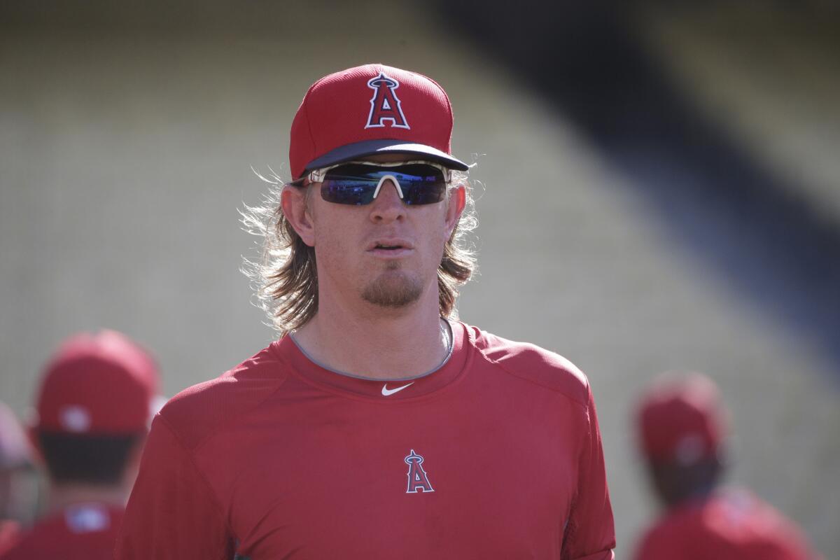 Angels pitcher Jered Weaver walks on the field before a game against the Dodgers on July 31.
