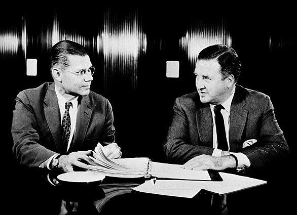 Robert S. McNamara, left, is pictured in 1960 with Ford Motor Co.'s then-board chairman and chief executive, Henry Ford II. McNamara was the company's first president outside of the Ford family.