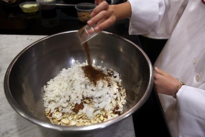 Combine oats, wheat bran, pecans, almonds and coconut in a large bowl. Then stir in cinnamon, nutmeg and brown sugar.