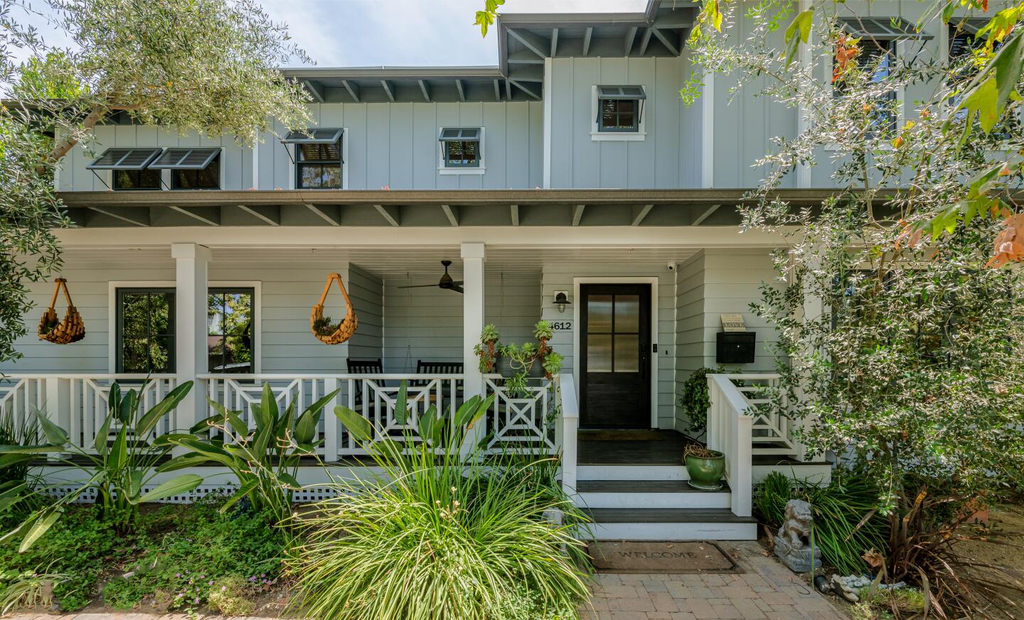 In classic farmhouse fashion, the stylish house pairs white walls with wide-plank floors across 4,500 square feet.