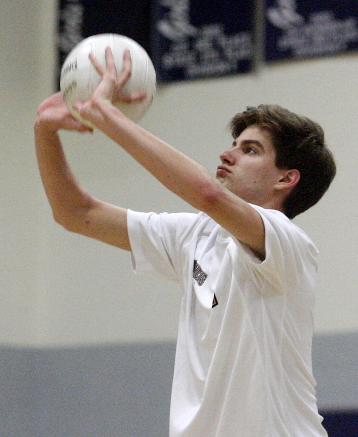 FILE PHOTO: St. Francis' Charles McCarthy sets the ball from the back line against Flintridge Prep in a non-league boys volleyball match on Monday, March 4, 2013. The senior outside hitter was named to Mission League's first team.