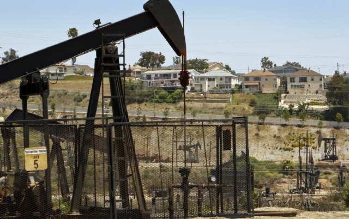 Homes along Onacrest Drive in the Windsor Hills neighborhood of unincorporated L.A. County are seen above the Inglewood oil field operated by Plains Exploration & Production Co. Residents living in the area suspect damage from their homes may have been caused by possible "fracking" at the field.