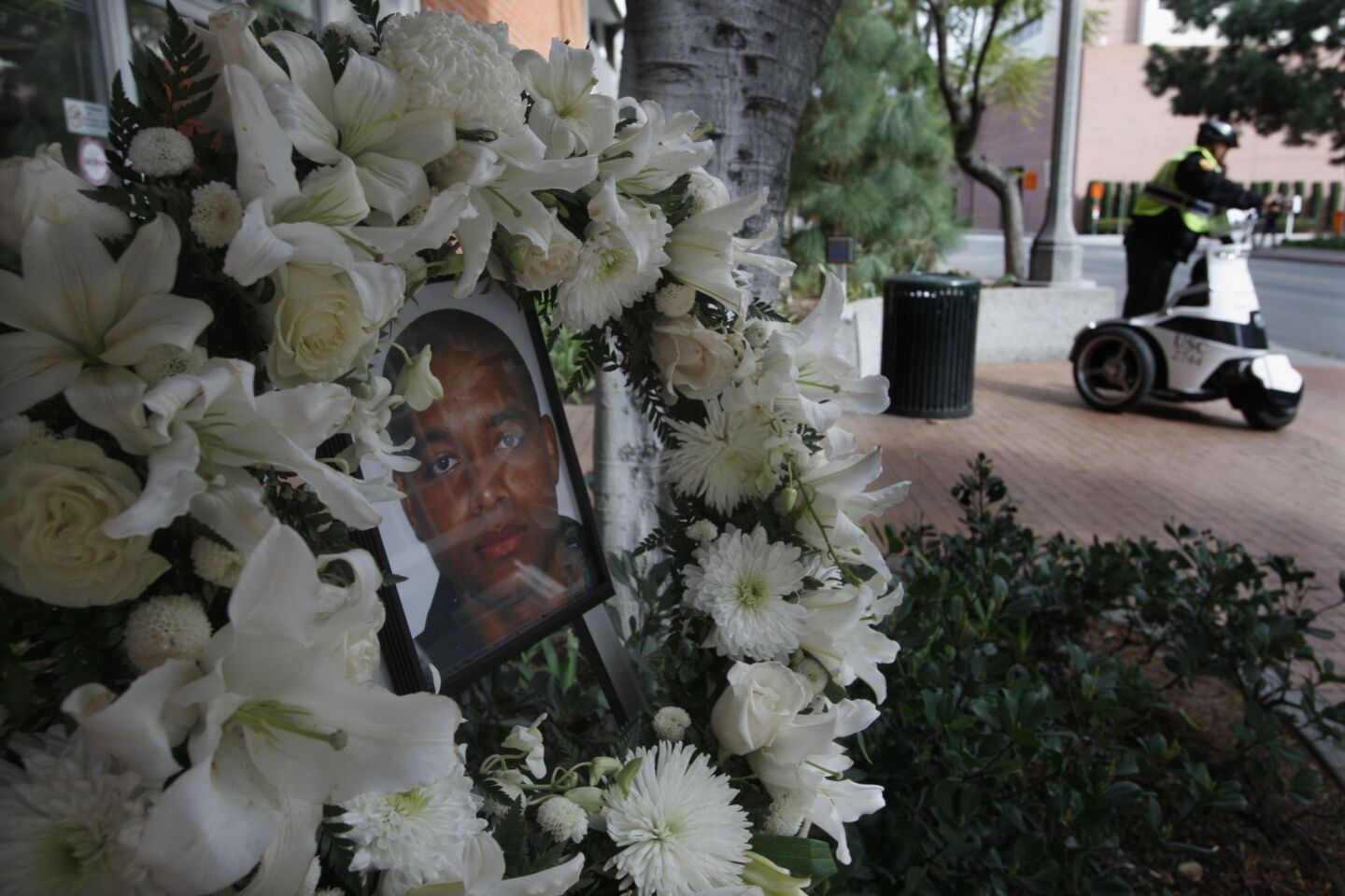 A memorial for USC Public Safety Officer Keith Lawrence is set up outside the Department of Public Safety on the USC campus Sunday.