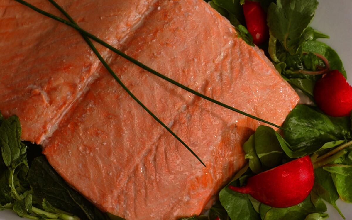 Oven-steamed wild salmon with homemade Green Goddess dressing and radish salad