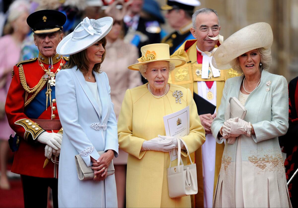 April 29, 2011: Prince Phillip, from left, Carole Middleton, Queen Elizabeth II and Camilla, Duchess of Cornwall stand outside Westminster Abbey after the wedding.