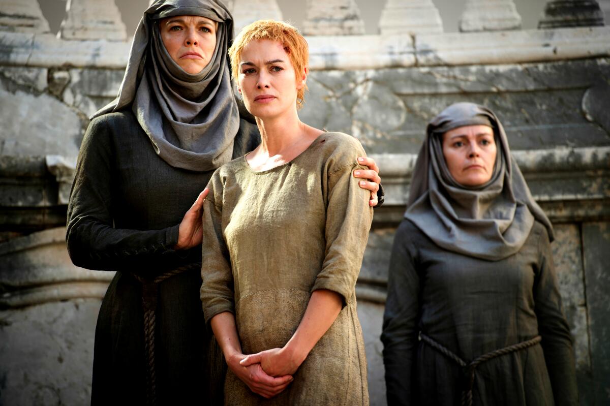 Hannah Waddingham in drab nun's garb readies Queen Cercei (Lena Headey) for her walk of shame on "Game of Thrones."