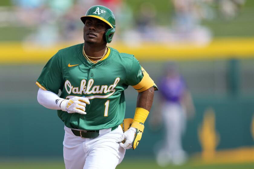 Oakland Athletics' Esteury Ruiz rounds the bases after hitting a solo home run against the Colorado Rockies during the second inning of a spring training baseball game, Saturday, Feb. 24, 2024, in Mesa, Ariz. (AP Photo/Matt York)