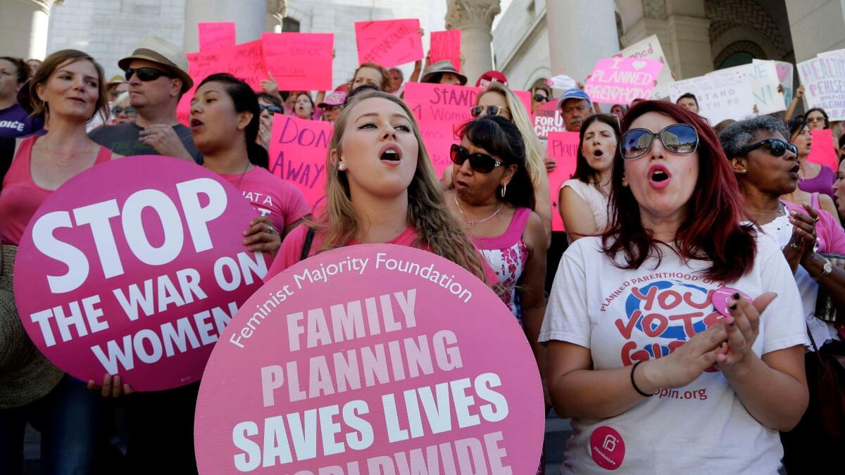 Planned Parenthood supporters rally for women's access to reproductive health care at Los Angeles City Hall on Sept. 9, 2015.