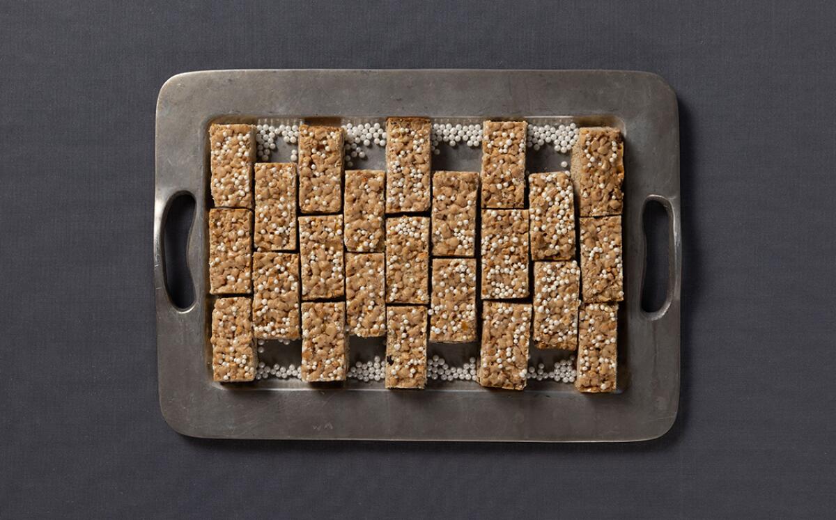 Rectangular cookies seen from overhead on a metal baking tray.