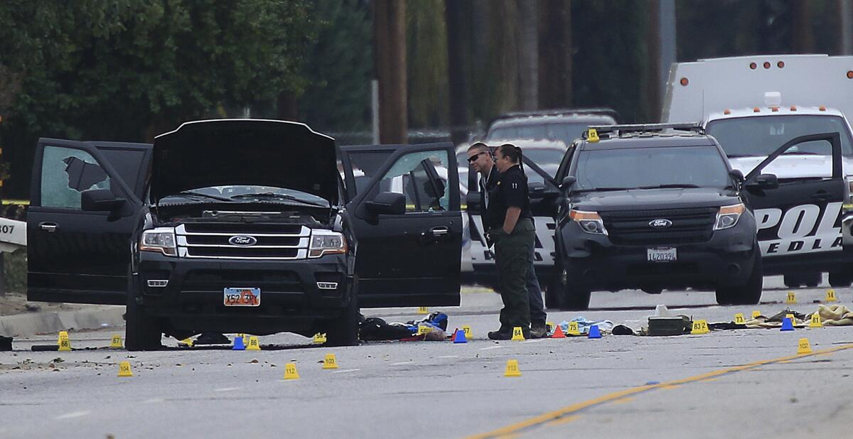 Crime scene investigators search Syed Rizwan Farook and Tashfeen Malik's SUV after a gun battle with the couple in San Bernardino on Dec. 4, 2015.