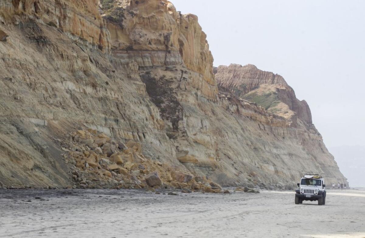 Local officials are warning people of the dangers of relaxing on the beach underneath unstable cliffs. At Torrey Pines State Beach in San Diego debris from a recent cliff collapse could be seen on Thursday, Aug. 8, 2019.