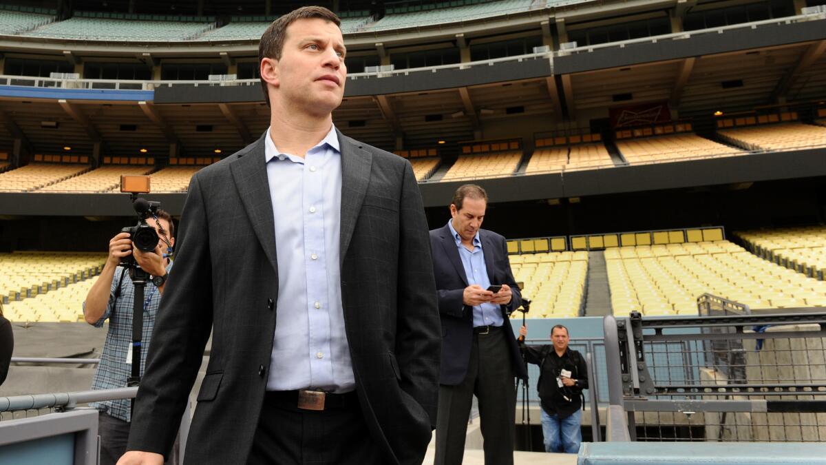 Andrew Friedman, the Dodgers newly appointed President of Baseball Operations, looks on while standing in Dodger Stadium before a news conference in October.