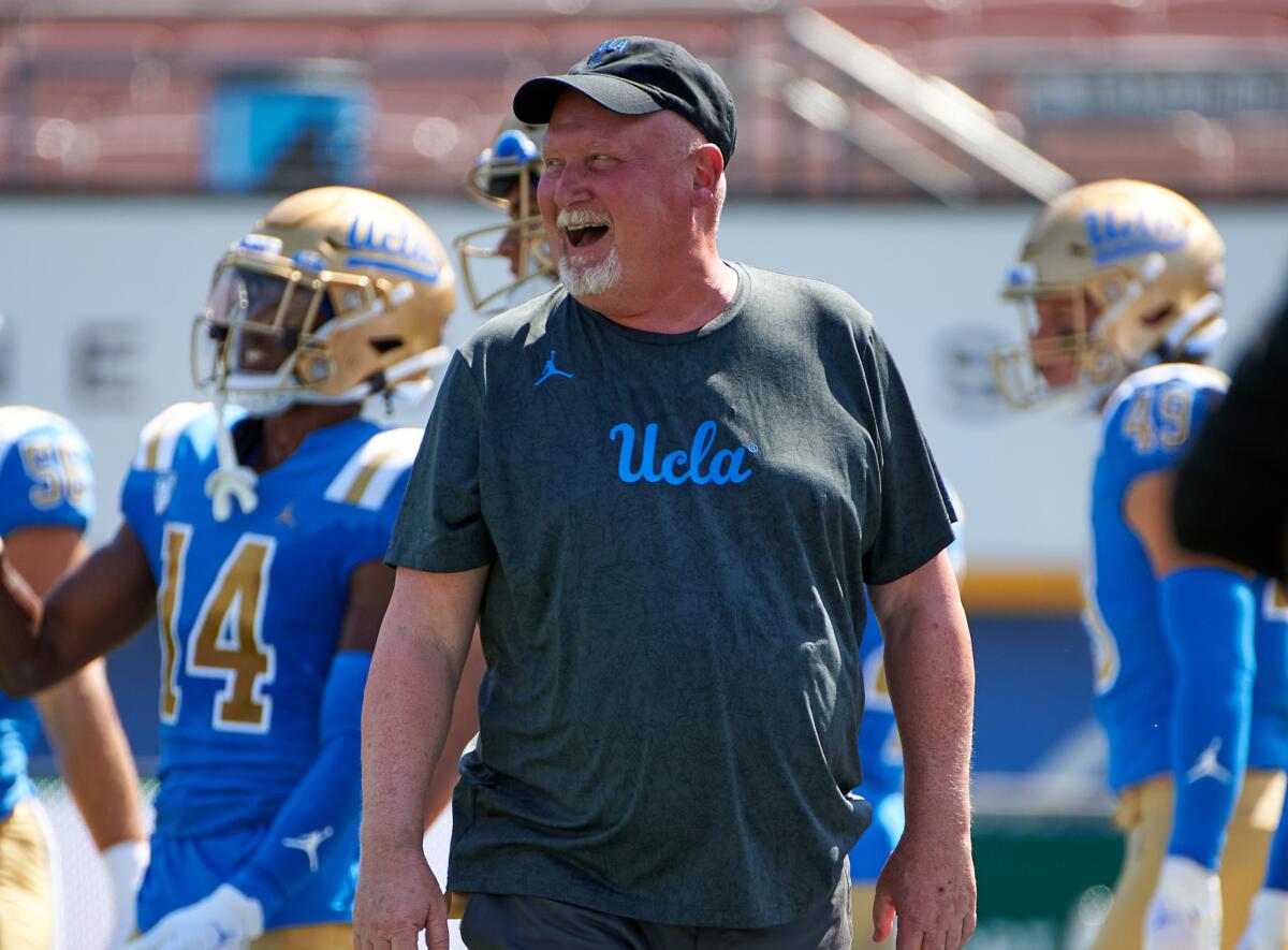 UCLA defensive coordinator Bill McGovern watches a football game from the sideline in 2022.