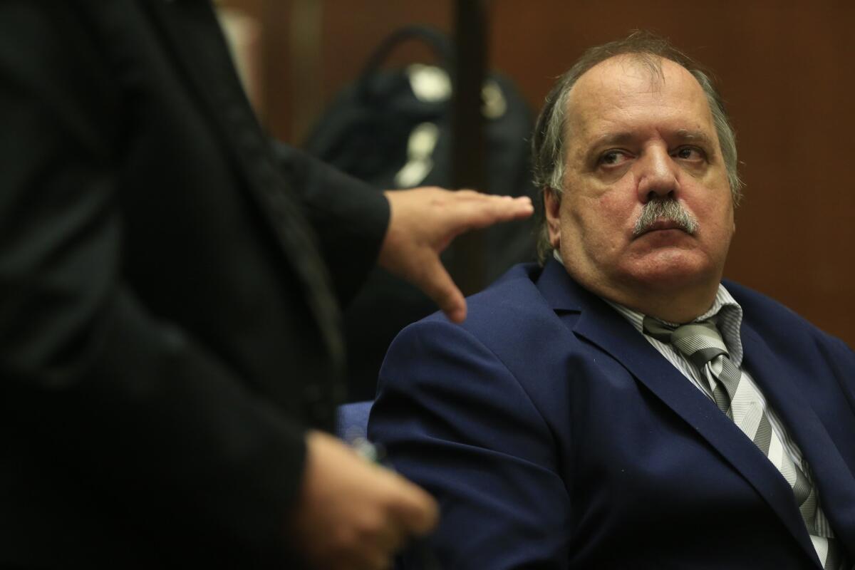 Former Bell City Councilman Victor Bello listens to his sentencing proceedings in Los Angeles Superior Court. Bello was ordered to serve one year in jail and five years' probation for his role in the Bell corruption scandal.