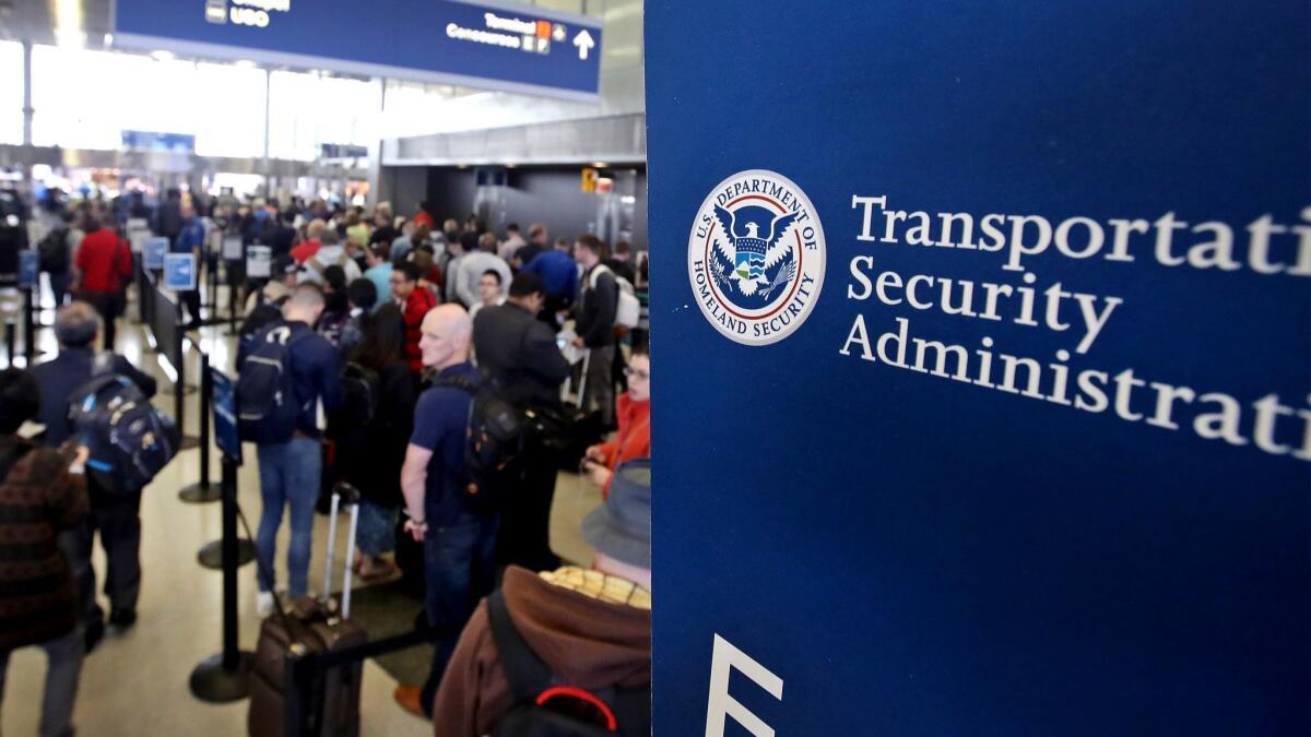 Passengers at Chicago O'Hare International Airport wait to be screened at a Transportation Security Administration checkpoint on May 16, 2016. The TSA is playing down a report that the agency is considering pulling out of smaller airports to focus resources on larger ones.
