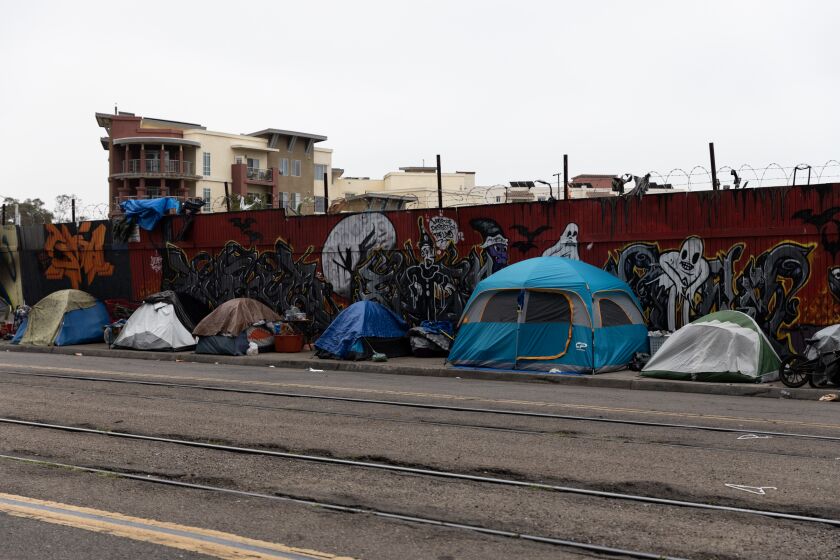 A homeless encampment alongside Commercial Street, which is just a block away from National Avenue and 16th Street in downtown San Diego, as seen on Friday, May 19, 2023.