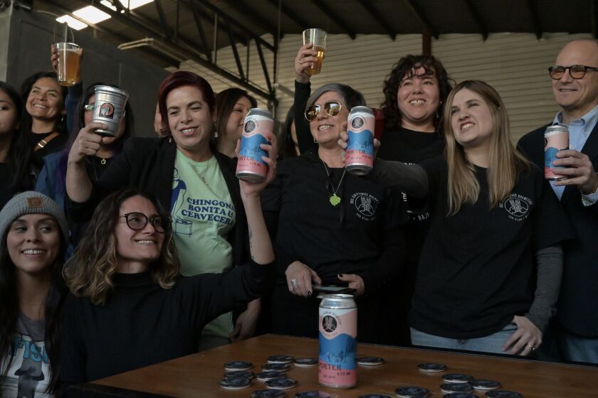 Women brewers from Tijuana and San Diego came together to uncover "TAP" of a craft beer as part of the celebrations of the bicentennial of diplomatic relations between Mexico and the United States. Tom Reott, the Consulate General of the United States in Tijuana (far right) joined the bi-national group "Dos California Brewsters" on Saturday, March 25, 2023 in unveiling the exclusively produced craft beer by the women in Ludica Cerveceria. (Carlos Moreno / The San Diego Union-Tribune)