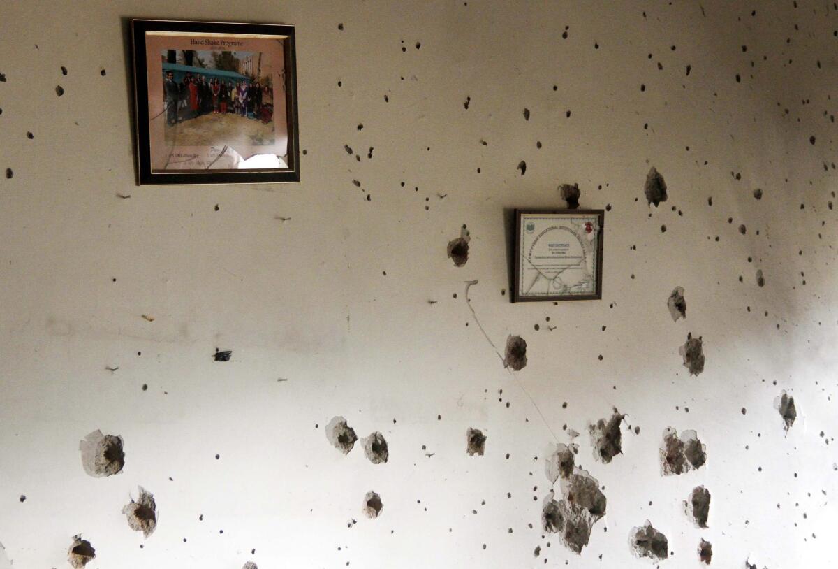 A bullet-ridden wall stands at a school in Pakistan after an attack that left 132 children dead.