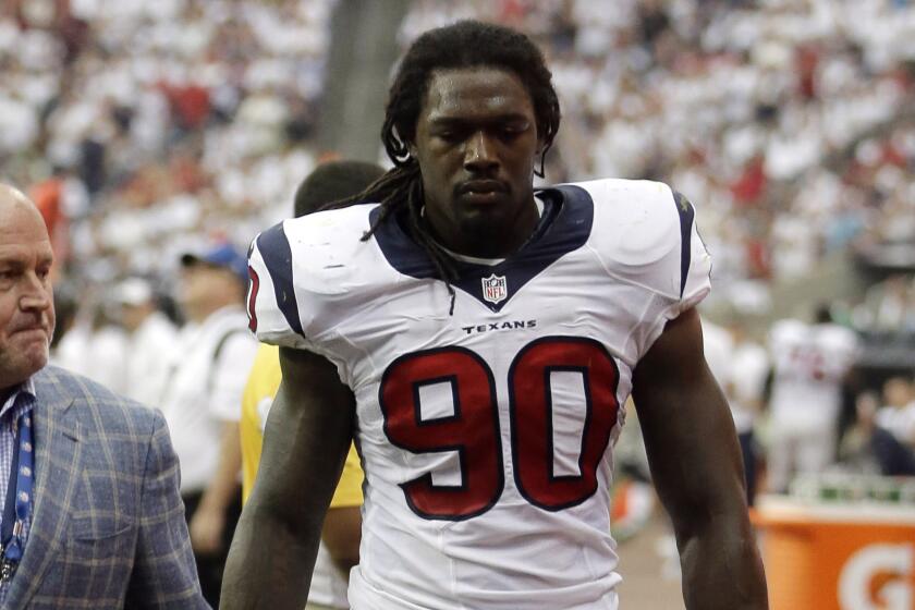 Houston's Jadeveon Clowney leaves Sunday's game against the Washington Redskins after suffering a knee injury.