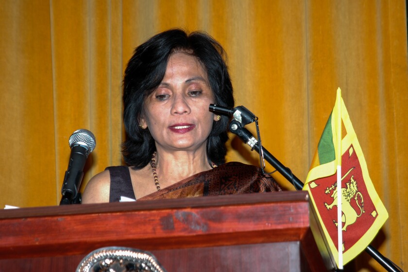 Hassina Leelarathna at a lectern.