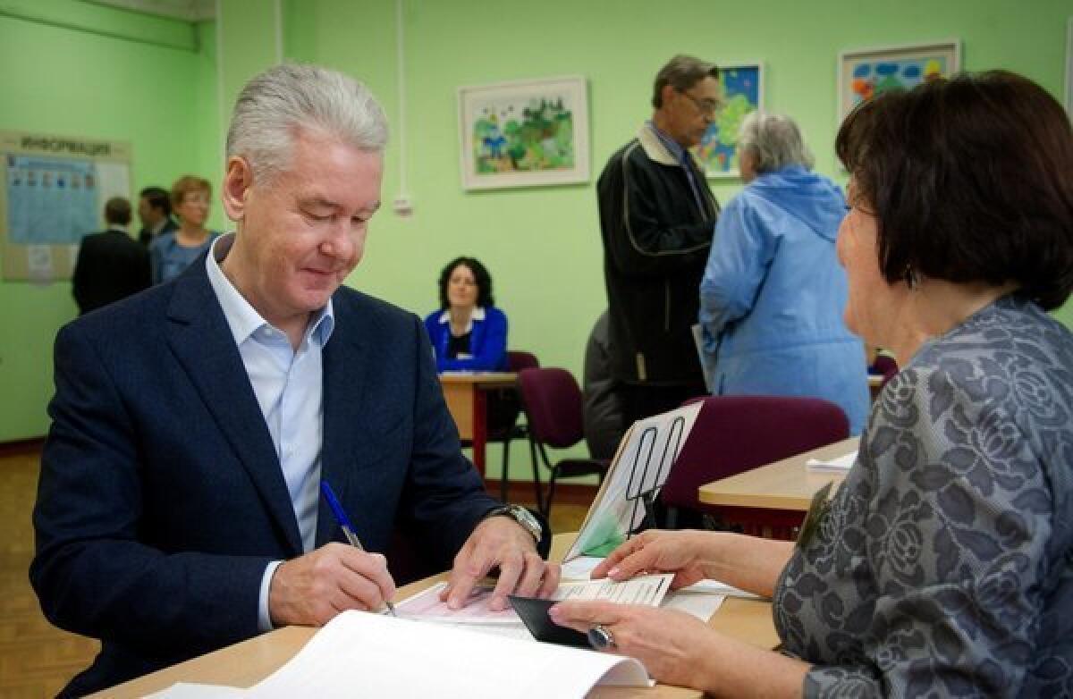 Acting Mayor Sergei Sobyanin gets his ballot at a polling station during a mayoral election in Moscow on Sunday. Sobyanin later declared victory.