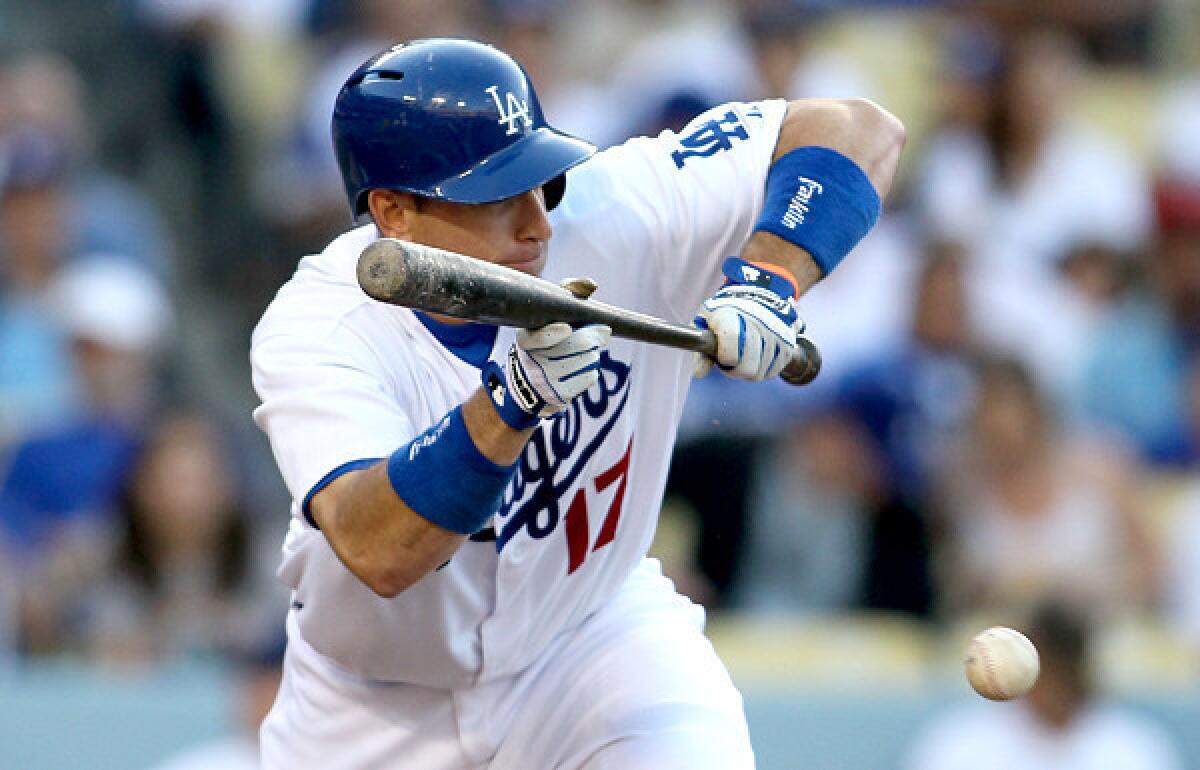 Dodgers catcher A.J. Ellis, bunting against the Marlins in a game earlier this season, came out of the Cardinals series this weekend worse for the wear.
