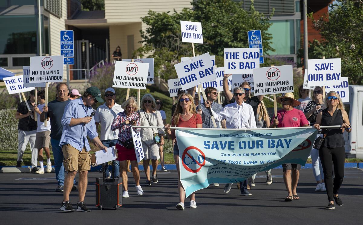 Friends of Newport Harbor walk to Newport Beach City Hall to protest.