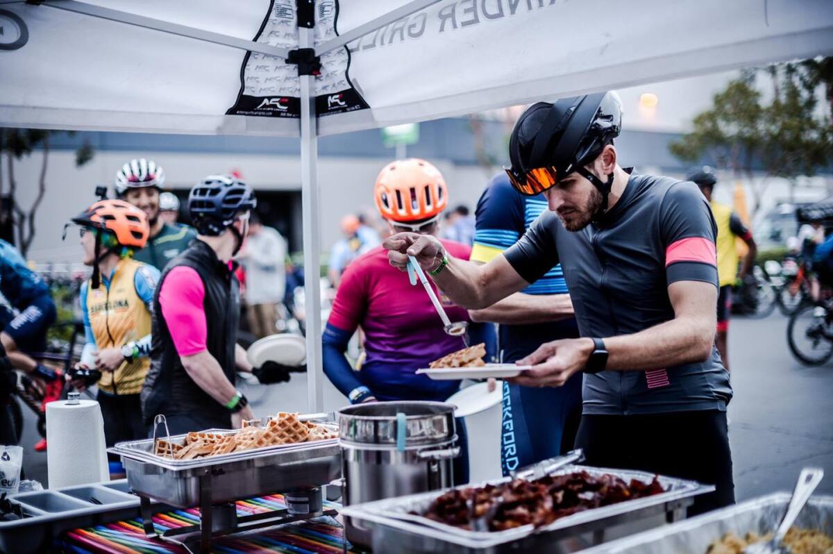 After the Belgian Waffle Race, a participant enjoys some waffles at the finish line.