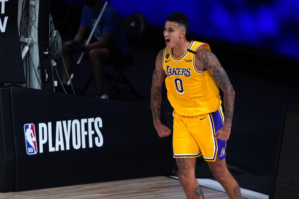 Lakers forward Kyle Kuzma celebrates during the second half against the Portland Trail Blazers.