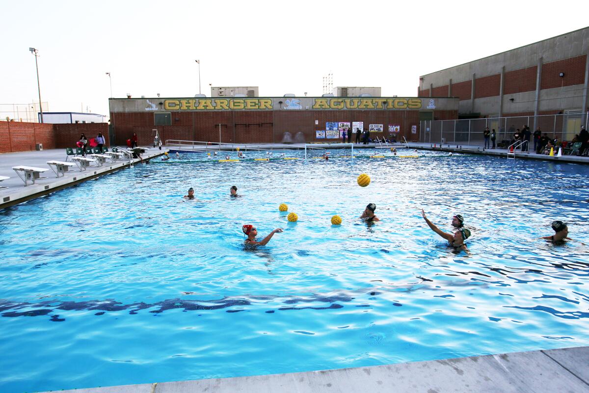 Edison girls varsity water polo team warms up in their new 40-meter-by-25-yard pool.